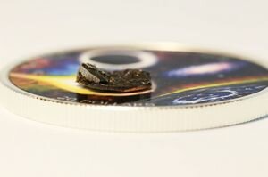 В Канаде выпустили коллекционную монету с метеоритной инкрустацией